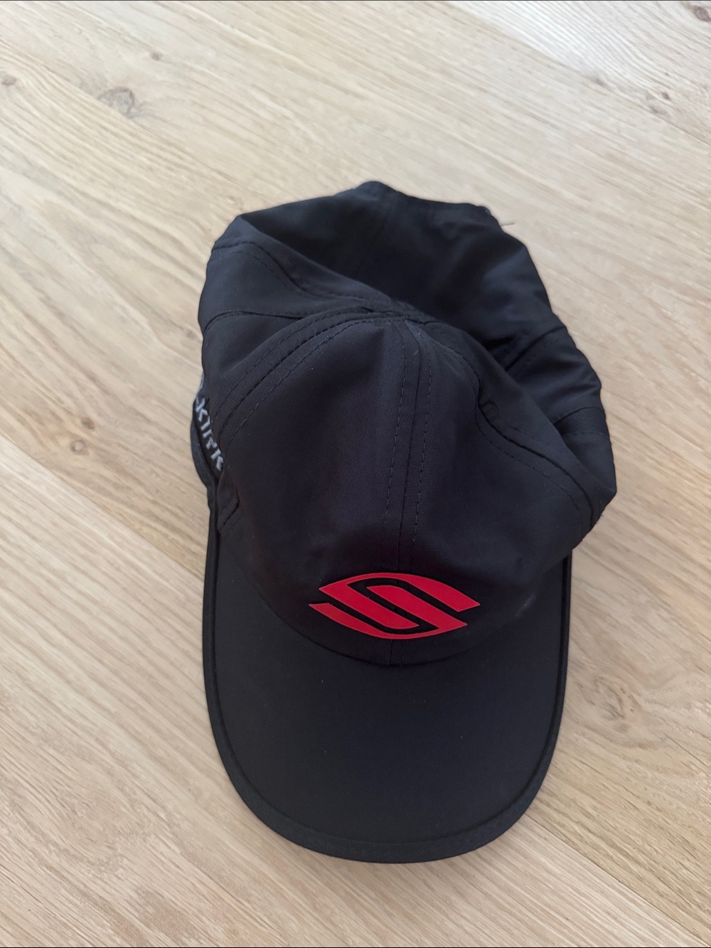 Black Women's Performance Cap with Red Logo - Selkirk